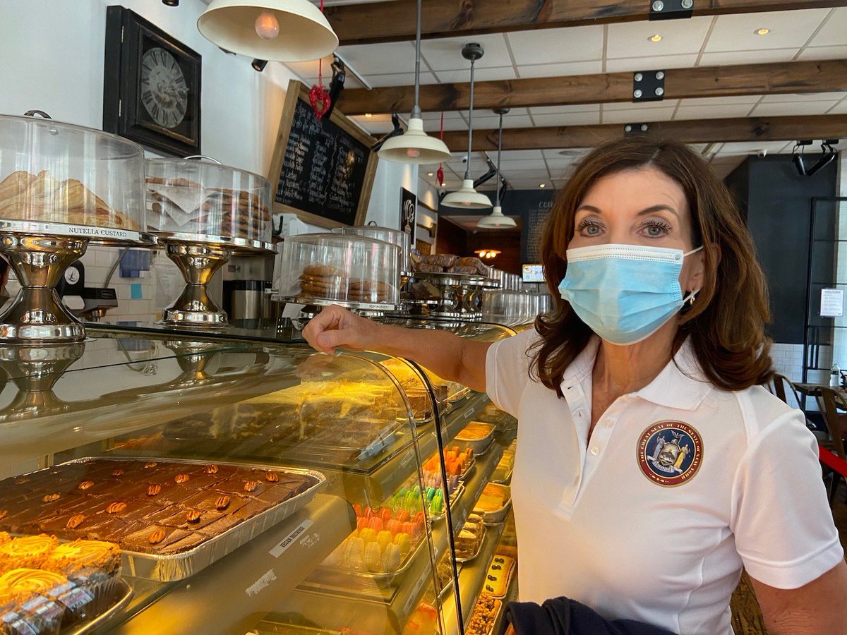 Gov. Hochul stands in a bakery in Astoria.