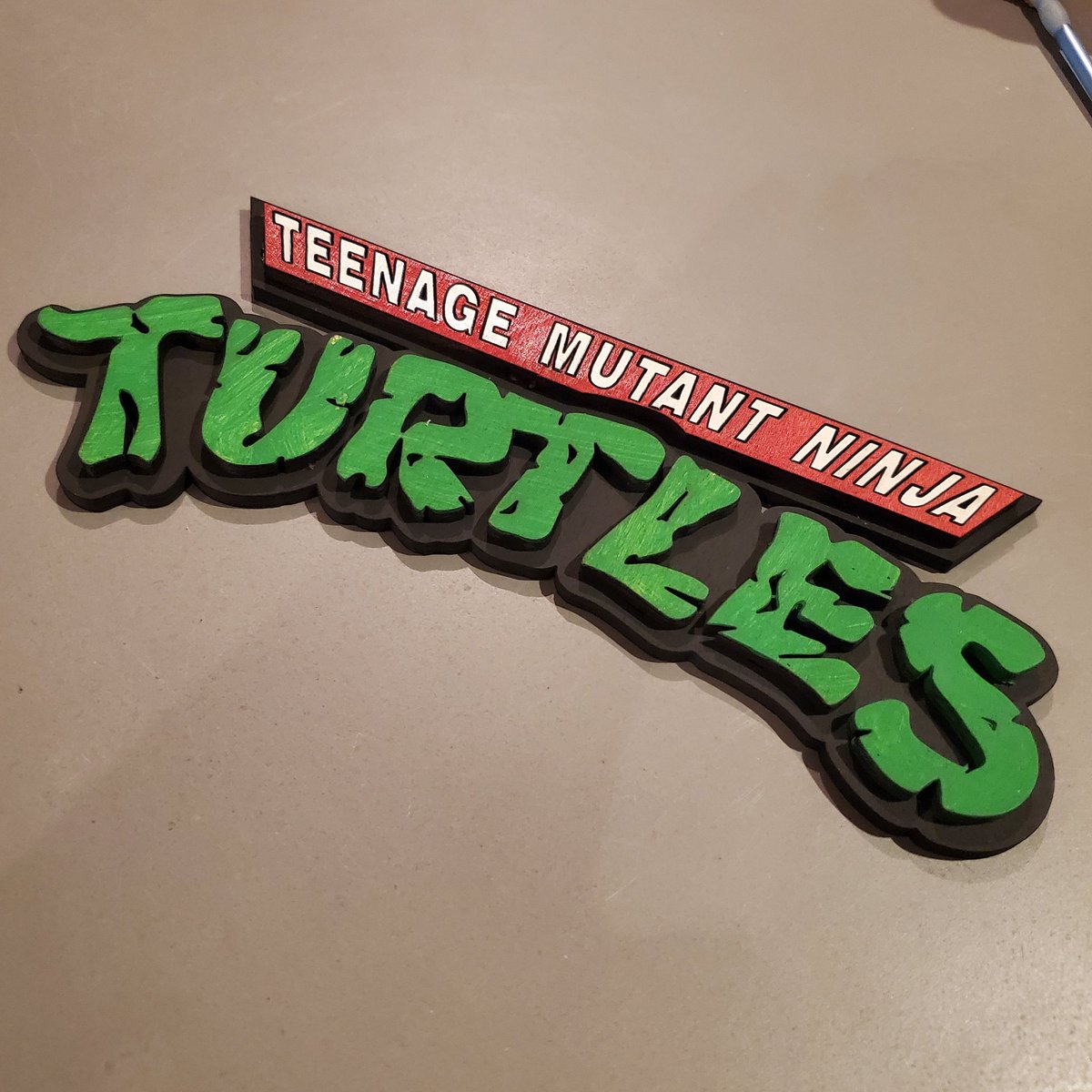 bussells's tweet image. Putting the laser cutter to work tonight making some 3D wooden TMNT logos.