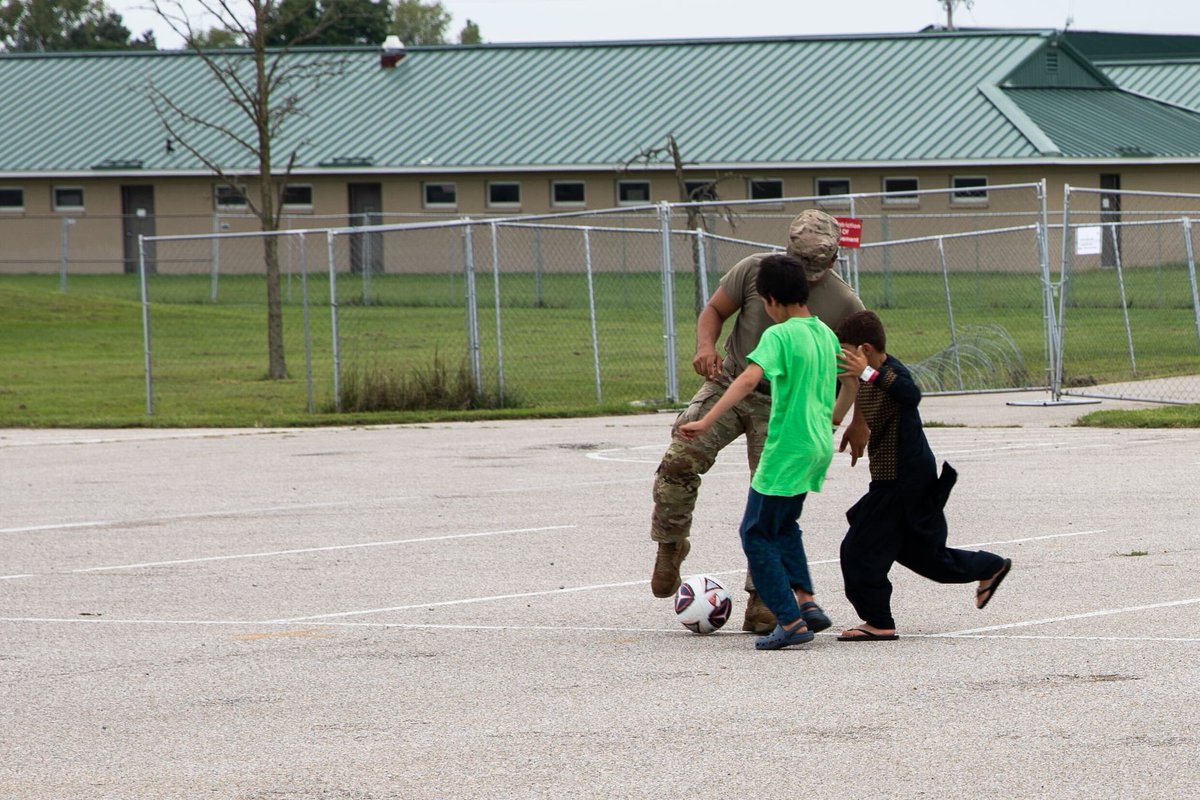 wrtv's tweet image. Camp Atterbury shared these photos of Afghan evacuee children playing soccer with soldiers ⚽