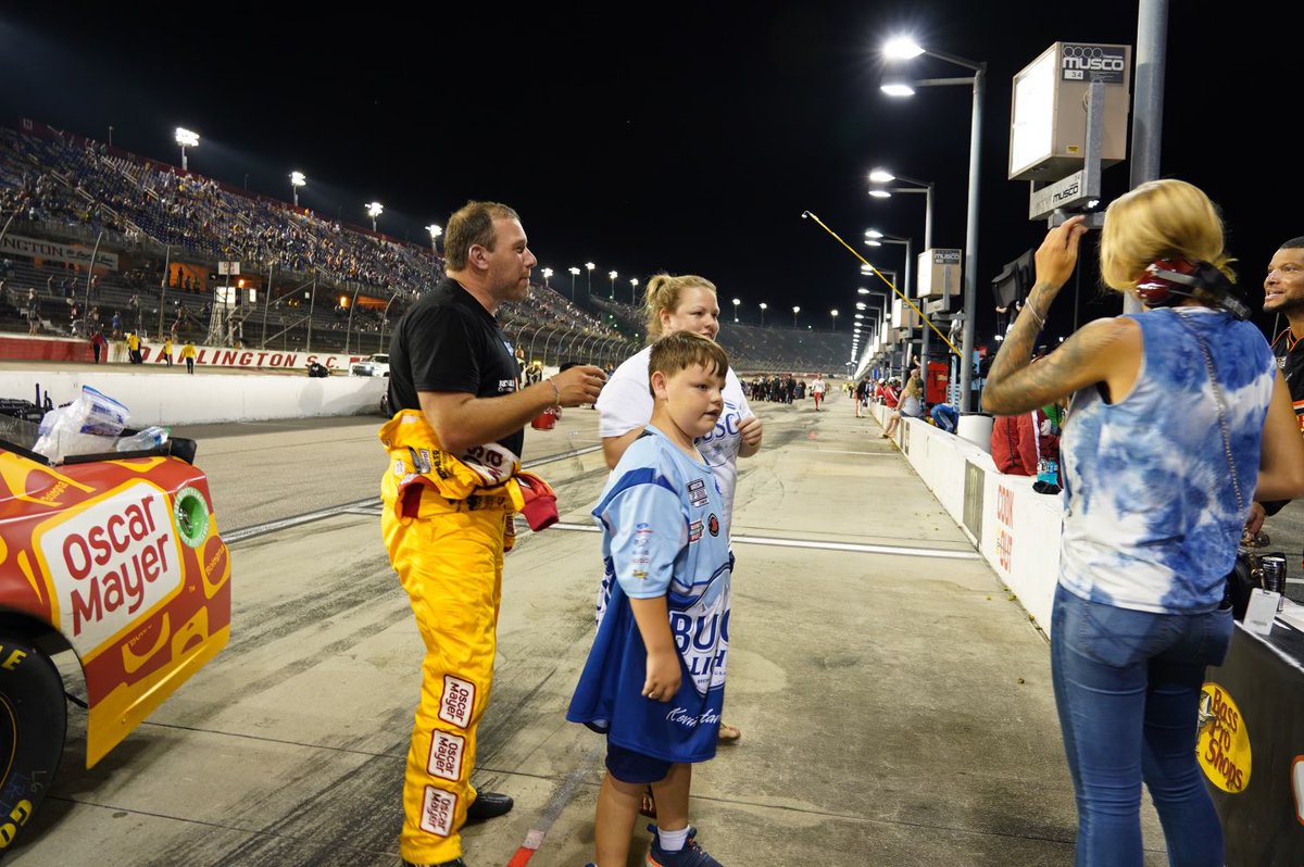 .<a href="/RyanJNewman/">Ryan Newman</a> takes time for a young fan after a long race <a href="/TooToughToTame/">Darlington Raceway</a>. 
<a href="/oscarmayer/">Oscar Mayer</a>