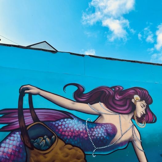ThisIsGalway's tweet photo. We LOVE discovering the beautiful murals around Galway, and the latest addition is looking seriously cool 🧜‍♀️💜 Have you spotted her on the side of @Hookedgalway yet? 

Follow @thisisgalway for more photos of Galway and use our hashtag #thisisgalway to get your photos featured! https://t.co/JwdcrOMV5N