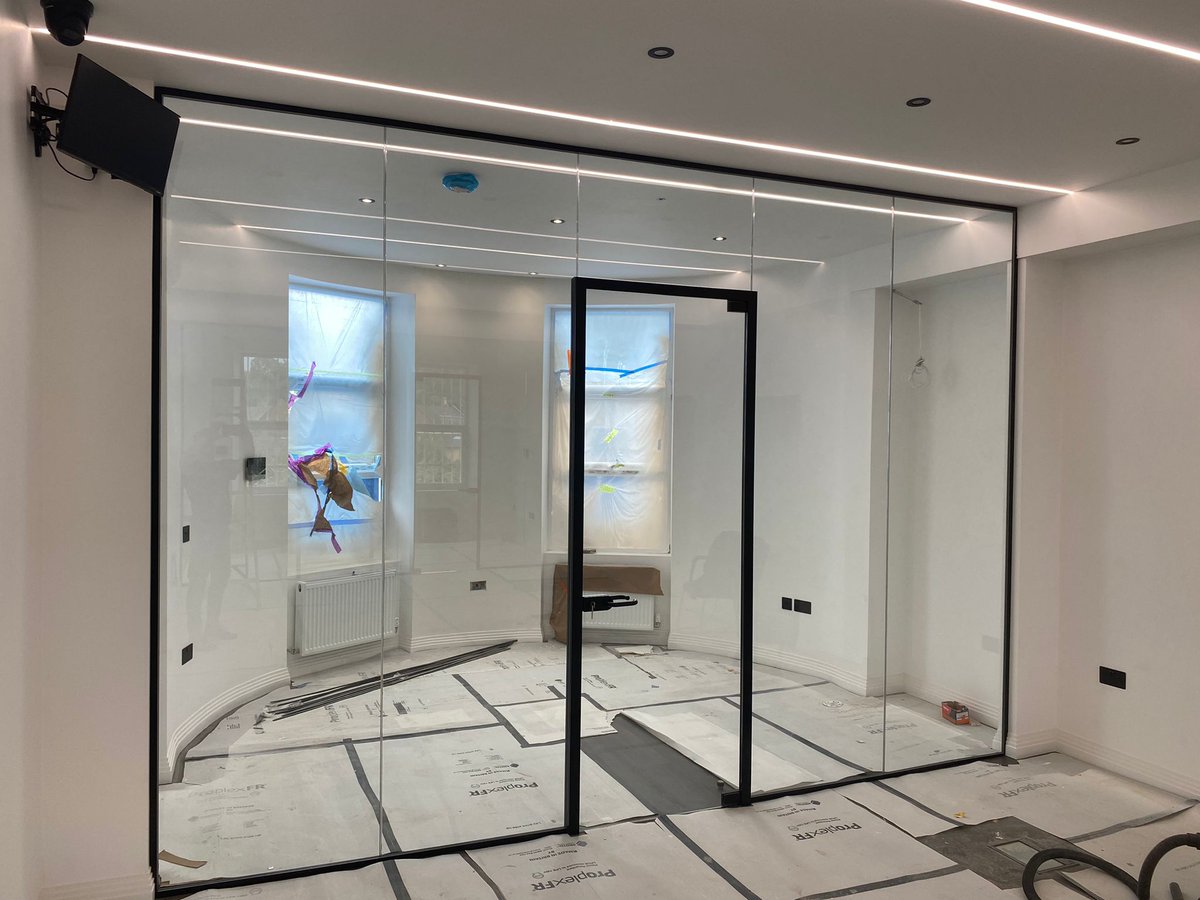 PremfixLondon's tweet photo. Recently completed glass partition offices in Stamford Hill London. Manifestation to follow. Black perimeter glazing tracks and door frames really create a stunning bold feature within the office. #glassoffices #glasspartitions https://t.co/qK7ZC5B6RK
