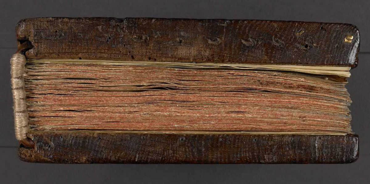 Vellum tends to buckle & ripple, it doesn't lie absolutely flat like paper. So it was bound between heavy wooden boards to keep it flat - this is the origin of the hardback book, a book format - expensive, hard to make, & prone to damage - almost never seen outside Europe.  3/