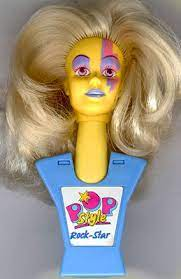 RetroSome's tweet photo. Tiny weird styling head dolls that you can wear on your person exist. https://t.co/B9L1pQkZdX