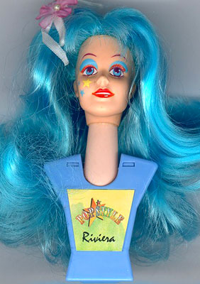 RetroSome's tweet photo. Tiny weird styling head dolls that you can wear on your person exist. https://t.co/B9L1pQkZdX