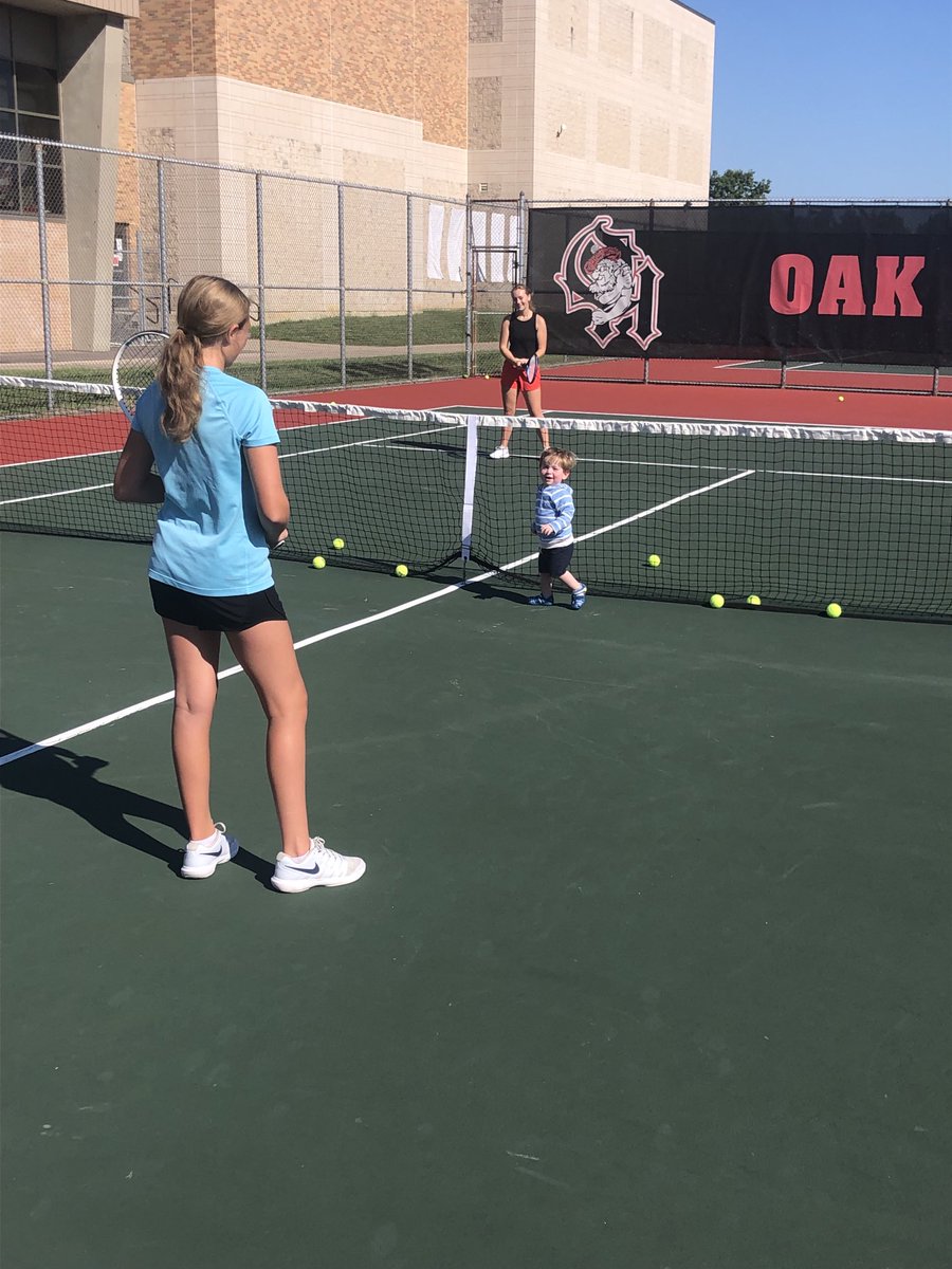 TennisOakHills's tweet photo. Oak Hills newest assistant tennis coach made his debut at practice today as the girls prepare for Bellbrook tomorrow. Unfortunately he didn’t use tennis etiquette when walking across courts during points. #HighlanderStrong #BringTheQi #TennisToddler https://t.co/BqJh9zaMXp