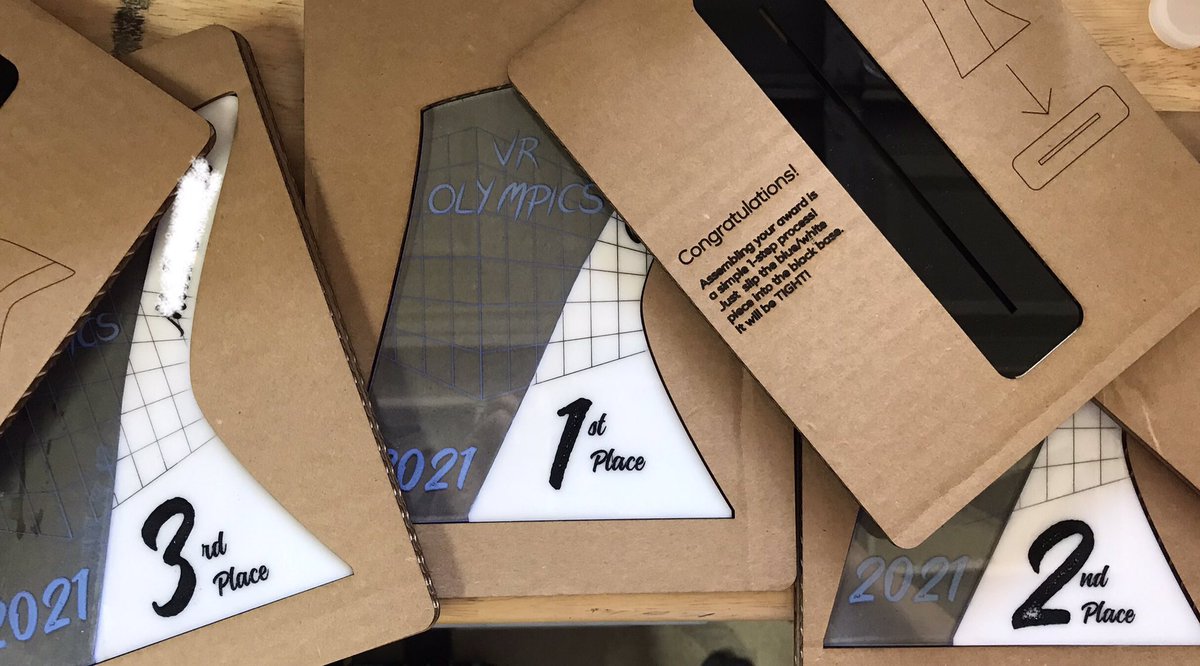 PeachesbytheSea's tweet photo. Special awards for the 2021 VR Olympics (with their special cardboard packaging) on the workbench today.
#glowforge
#laserfun
#lasercraft
#quest2 https://t.co/ndiRlErZq5