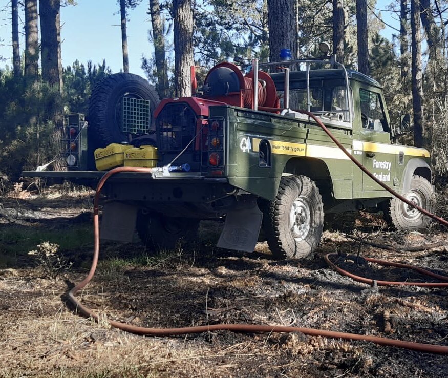 Land Rover fire vehicle helping to control fire in Forest