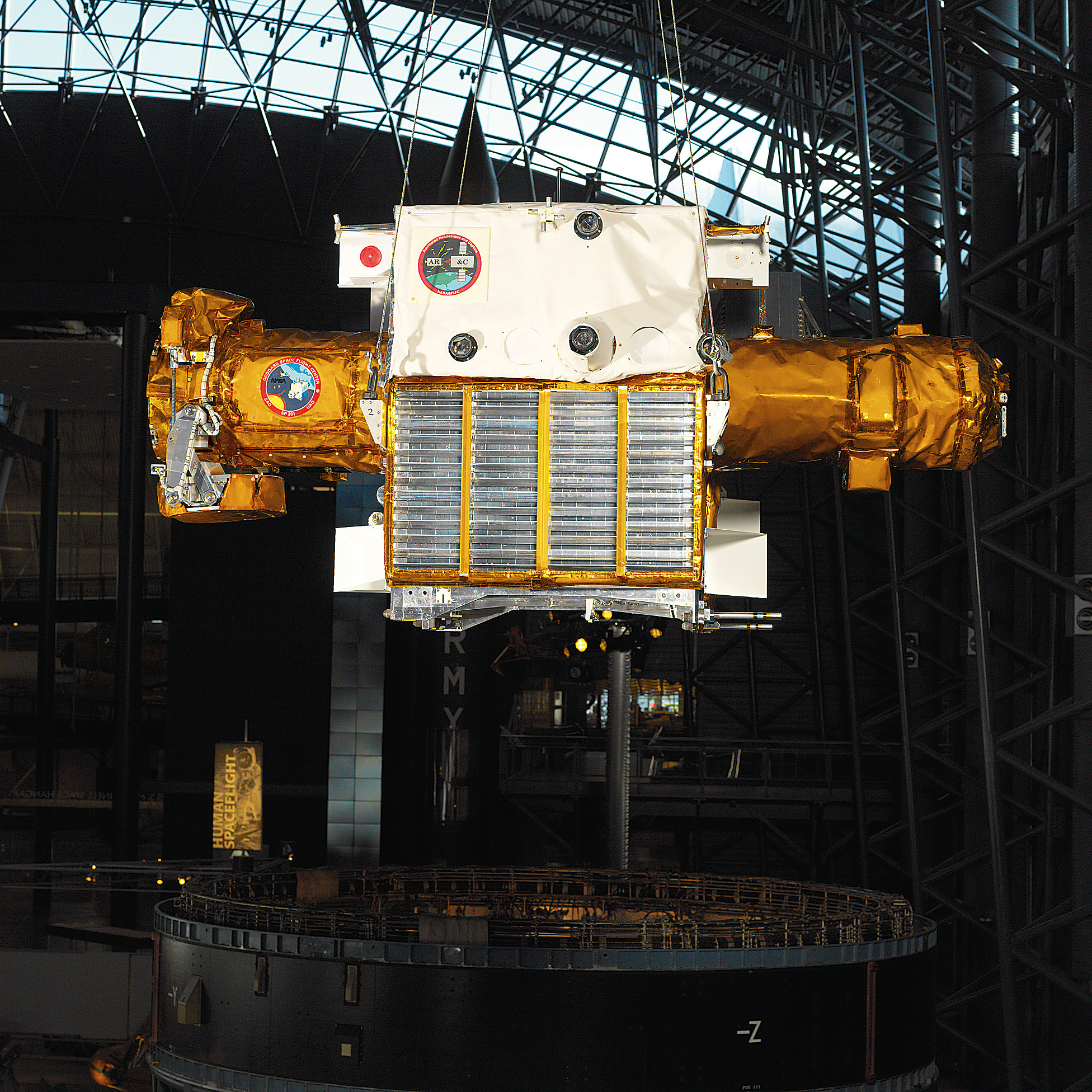 Gold metallic satellite on display in museum