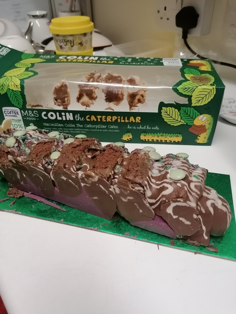 Bought a Colin the caterpillar cake from <a href="/marksandspencer/">M&S</a>, the <a href="/macmillancancer/">Macmillan Cancer Support</a> version as we work for Macmillan, at Cables Retail Park. The cakes were stored in the window and he ended up melted with no feet 😢