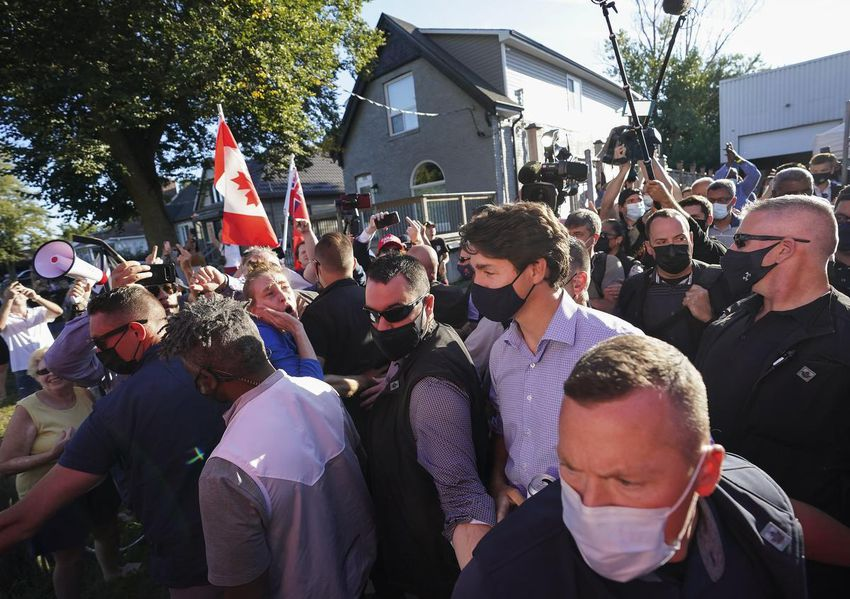adrianwkcheung's tweet photo. This is politics in Canada, 2021: rocks thrown @ Trudeau, kids screaming 'lock him up', slurs vs. Singh. Something is broken &amp; it won't be fixed over an election

I talked to @SusanDelacourt on the campaign &amp; @GrantRants on the workings of the protesters  https://t.co/EkjP9kHPRU https://t.co/BnsuIGA3Cf