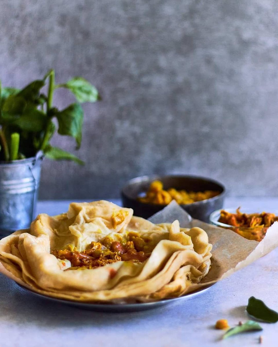 Have you tried dholl puri? Flaky, soft and warm, this is a street food staple in Mauritius. Load it up with curry and be prepared to get deliciously messy. mauritiusnow.com #mauritius #ttot #food  📸 @peachytales on Instagram