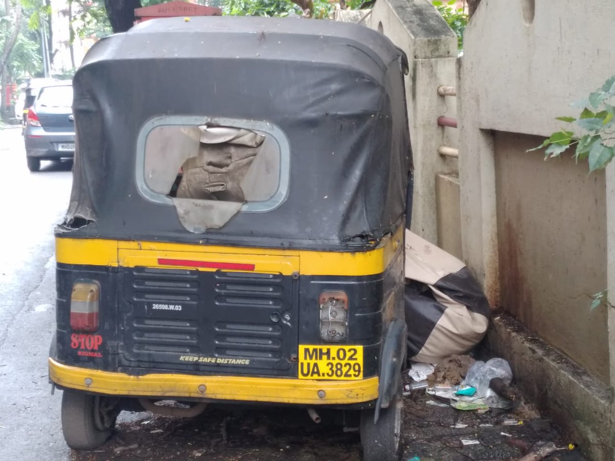 This abandoned autorickshaw is lying next to our building since 3 months. Many inebriated people have made this autorickshaw their home, they are also keeping the place untidy by throwing empty bottles of alcohol as it can be seen in this image.<a href="/MumbaiPolice/">मुंबई पोलीस - Mumbai Police</a> <a href="/mybmcWardPN/">Ward PN BMC</a>