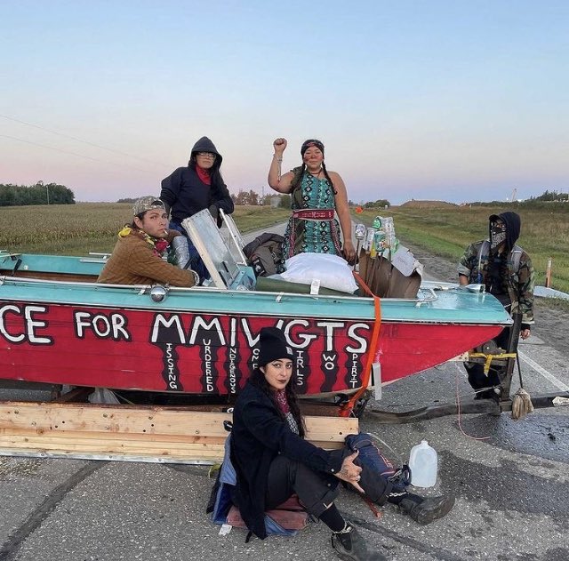 bearwitness2019's tweet photo. People around the world are standing up for their rights and protecting nature. Here #StopLine3 protesters block tar sands terminal. 

What’s #Biden doing? #

Nothing! https://t.co/uLJeF1nV76