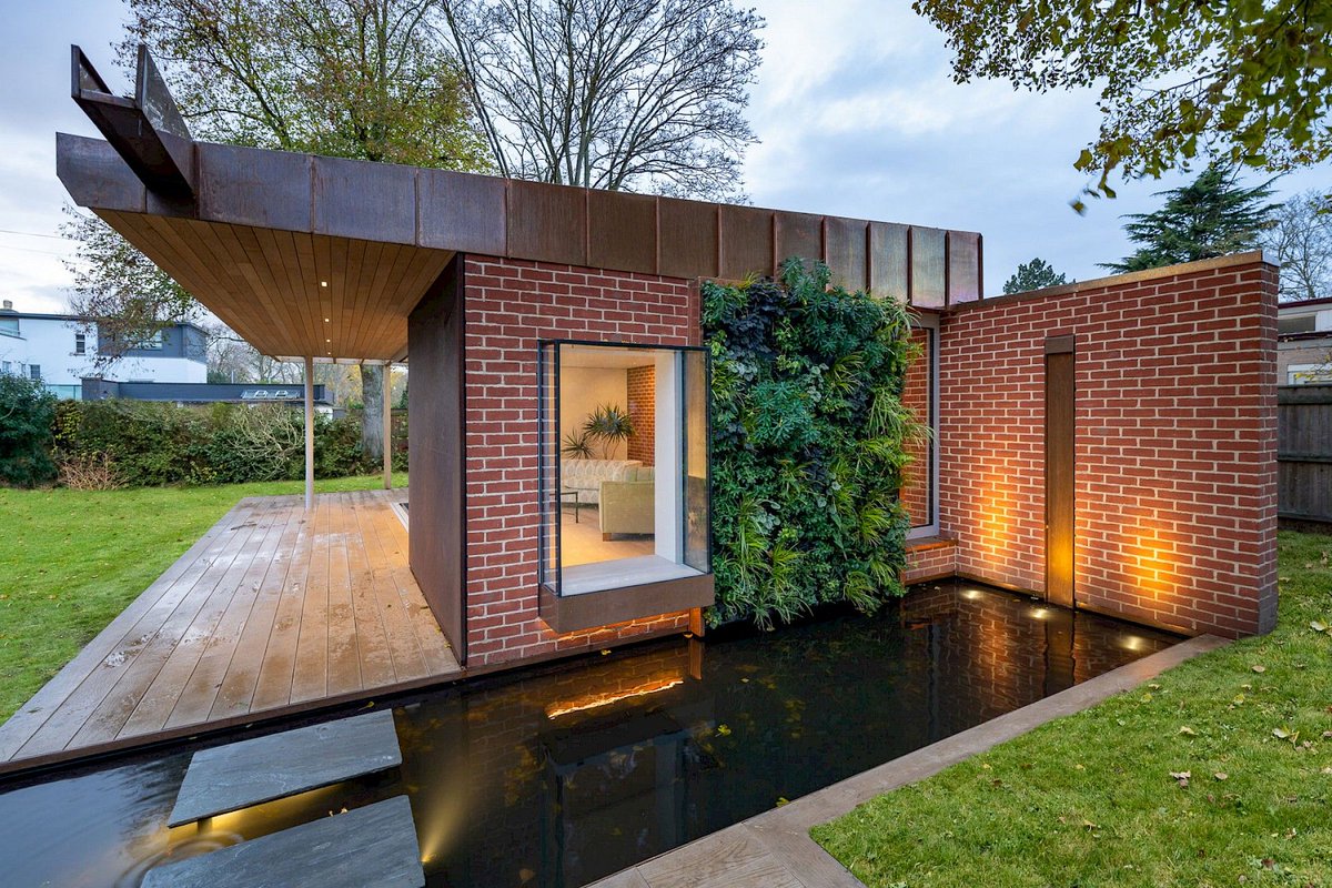 Our parent company Tills Innovations were required to bring water into the design of this interesting building. Copper was used for the roof and other elements, so a copper water wall was integrated into the brick wall. A mirror pool was installed below with stepping stones.
