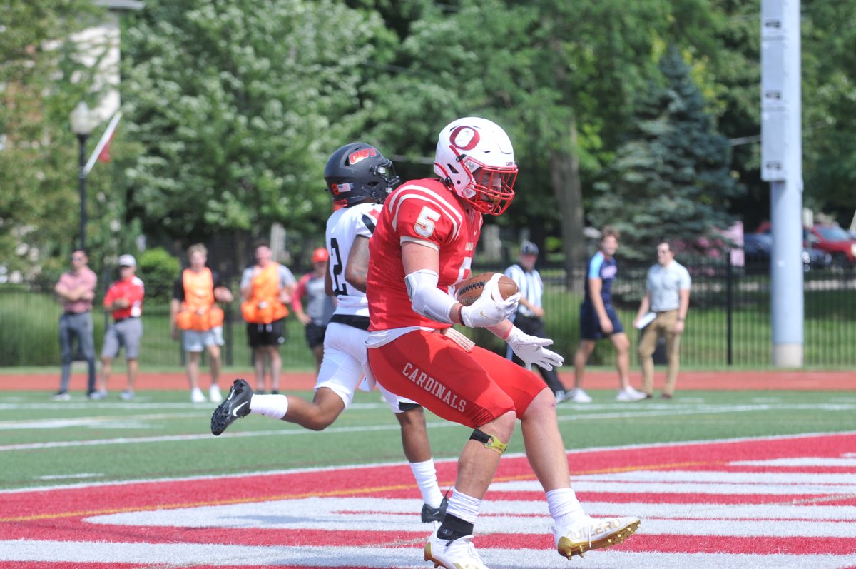 Ott_Athletics's tweet photo. ICYMI: Jeb Jones, who lost his father ten years ago, points to the heavens (second picture) after scoring the first of his two TD's in the season opener. He caught 11 passes for 114 yards, the highest single-game output for a Cardinal tight end since Jeff Gibbs back in 2001. 👍 https://t.co/eYkrckpT0u