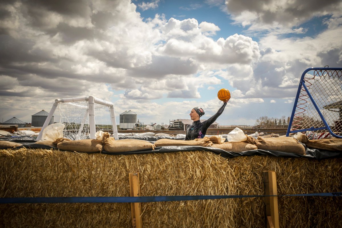 She’s winning for this picture of an Olympic water polo athlete training in a makeshift pool made from hay bales and tarps #NNA_CCJ
