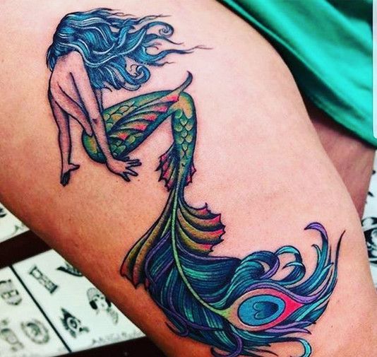 Mermaid tattoos with mirror presents self-value. It can represent how you see yourself. Mermaids are often portrayed with shells, such as a shell bra, for example, mirrors, bracelet, or earrings.