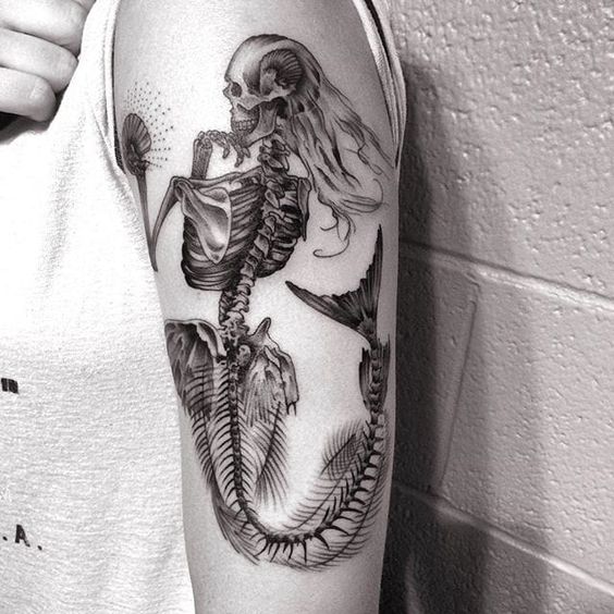 Mermaid tattoos with mirror presents self-value. It can represent how you see yourself. Mermaids are often portrayed with shells, such as a shell bra, for example, mirrors, bracelet, or earrings.