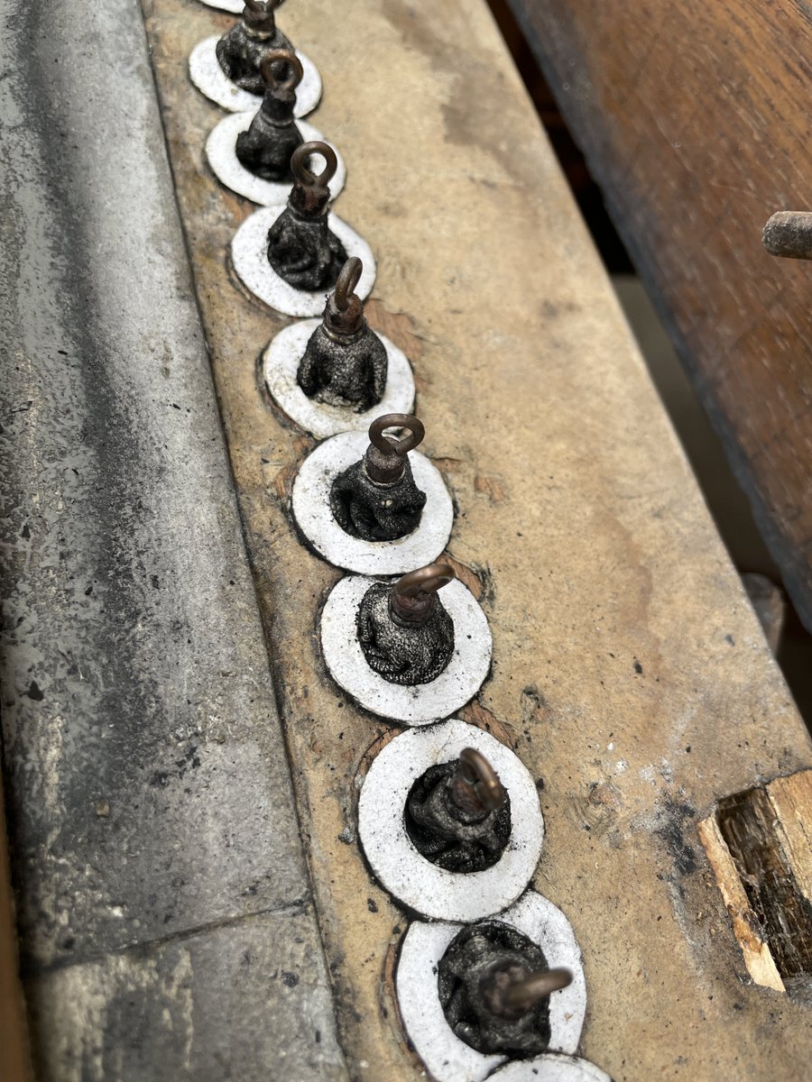 The soundboards of the Farnborough Abbey organ are stripped down for full restoration. The interior is extremely dirty with black soot and dried mildew (the Boursettes were once white!). There are additional pallets in the Great Soundboard for the Pedal/Grand Orgue Transmissions