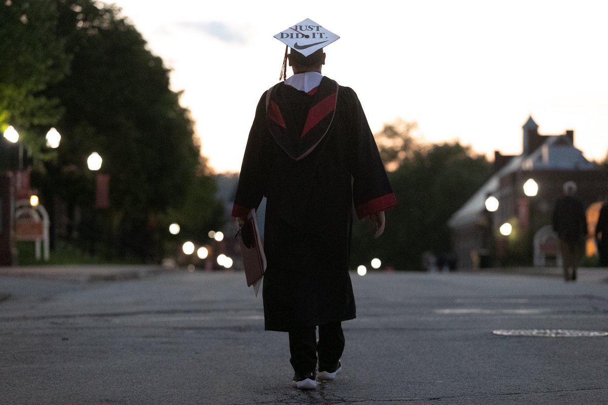 CalTimes's tweet photo. Cal U graduate Seth Shiley walks past the Natali Student Center after the #commencement ceremony for the School of Graduate Studies on Friday evening, May 7, 2021. #graduation #CaluComm #Classof2021 https://t.co/oUlcI8Tz4b