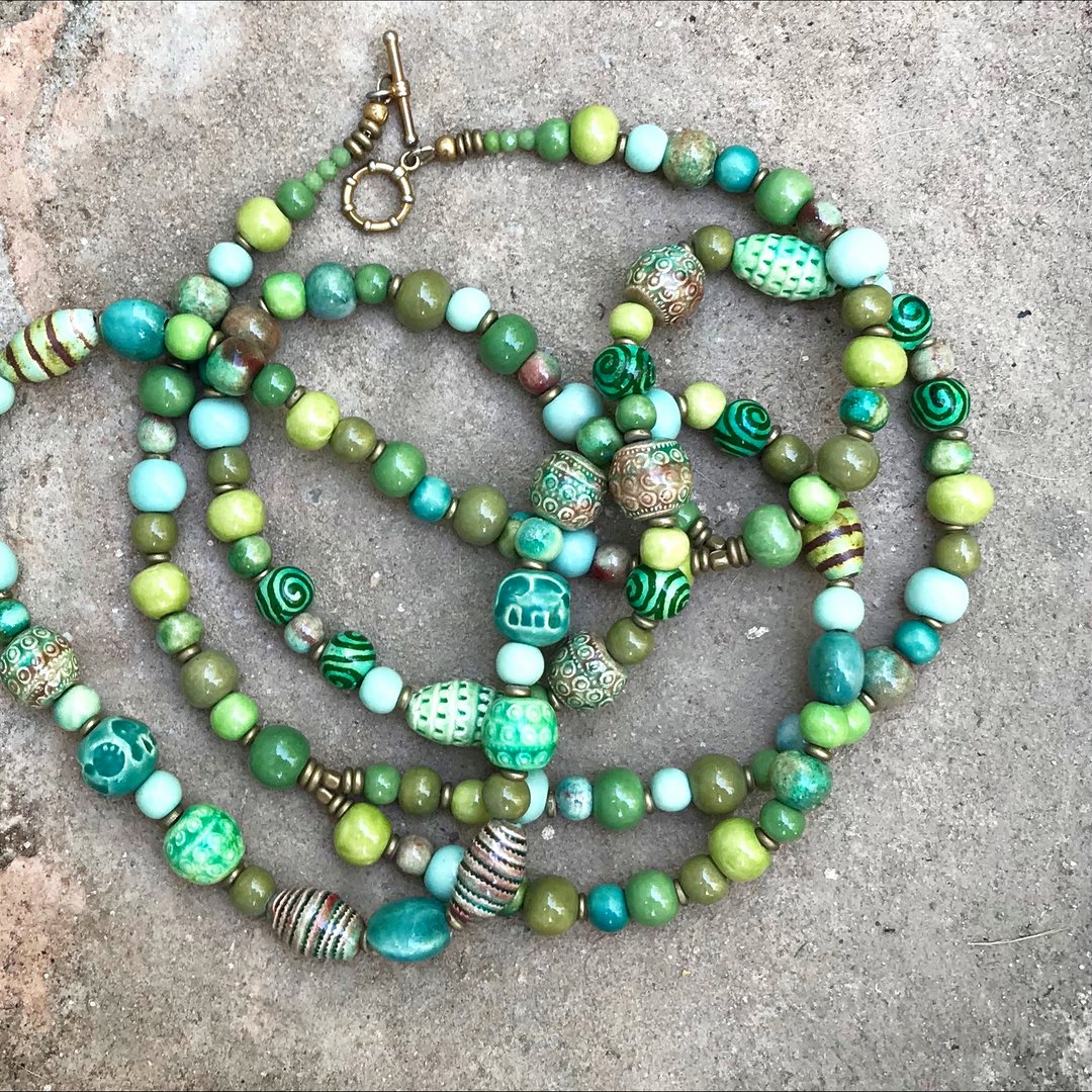 A beautiful double strand #bohonecklace in #monsoongreens Did you know we see more #greens than any other colour? We certainly have more #greenglazes than any other .. #beautifulgreens #gypsy #uniqueceramics #clay #bohobeads #handcrafted in #siemreap #cambodia #ethicalproduction