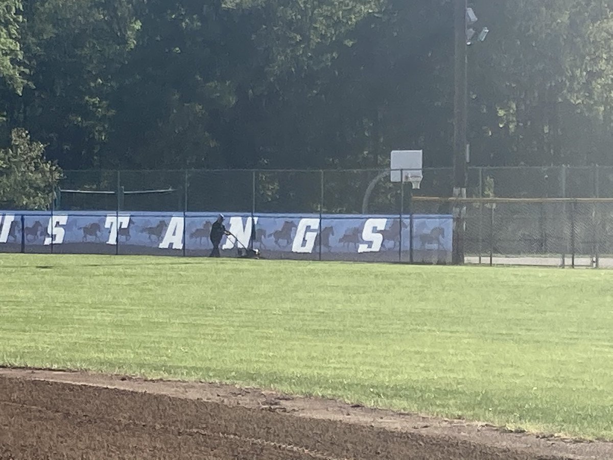 Shout out to the Madeira early morning ground crew .... AD Joe Kimling and way out in the outfield the Grassman mowing and getting ready for today’s game at noon against Mariemont.  Play Ball!  Go Madeira! <a href="/BaseballMadeira/">MadeiraBaseball</a>