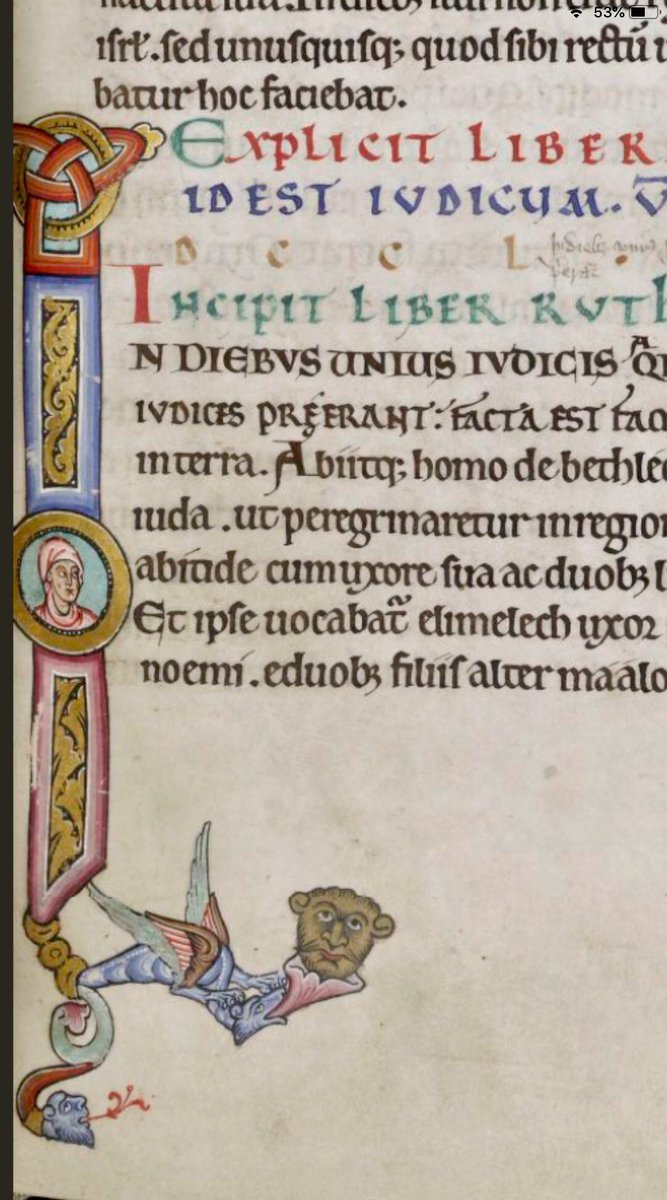 Initial 'I'(n) at the beginning of Ruth depicting head of Ruth and a dragon and grotesque head #MS003TheDoverBibleCambridge, Corpus Christi College, MS 003; The Dover Bible, Volume I; 12th century; f.112r  @ParkerLibCCCC