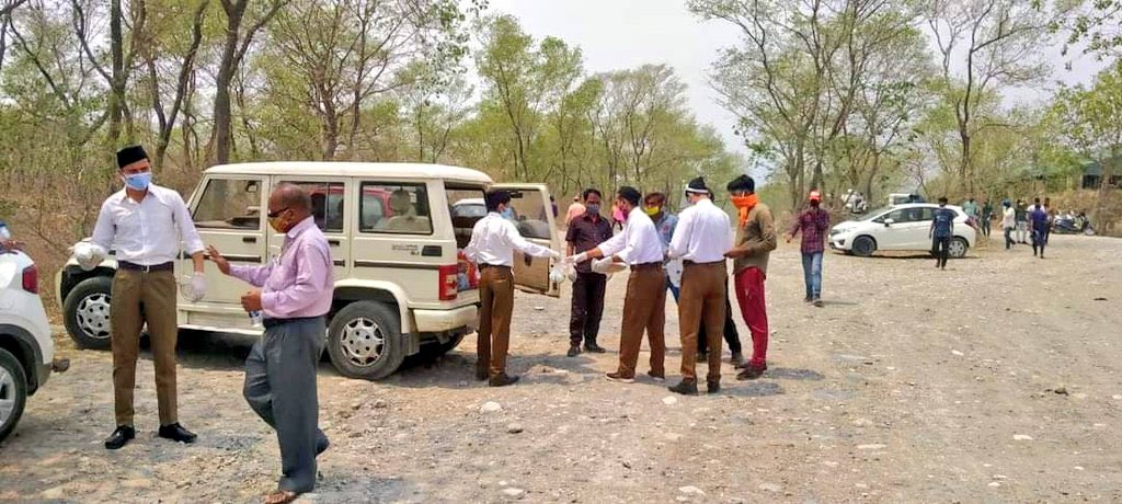 friendsofrss's tweet photo. For those who are asking #WhereIsRSS 

RSS volunteers are distributing food packets and drinking water to needy people at a crematorium in Haldwani, Uttarakhand. https://t.co/QQ6UIMUry3