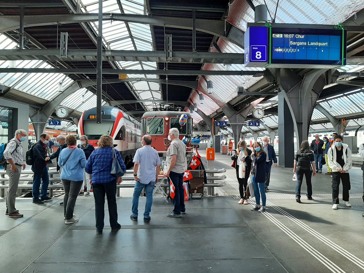 Zurich's large Hauptbahnhof. There are also dozens of tracks and an entire shopping centre underground. Outside facade is under renovation. The people with the Swiss flags on pic 3 were celebrating the last ride/retirement of the arriving train driver!