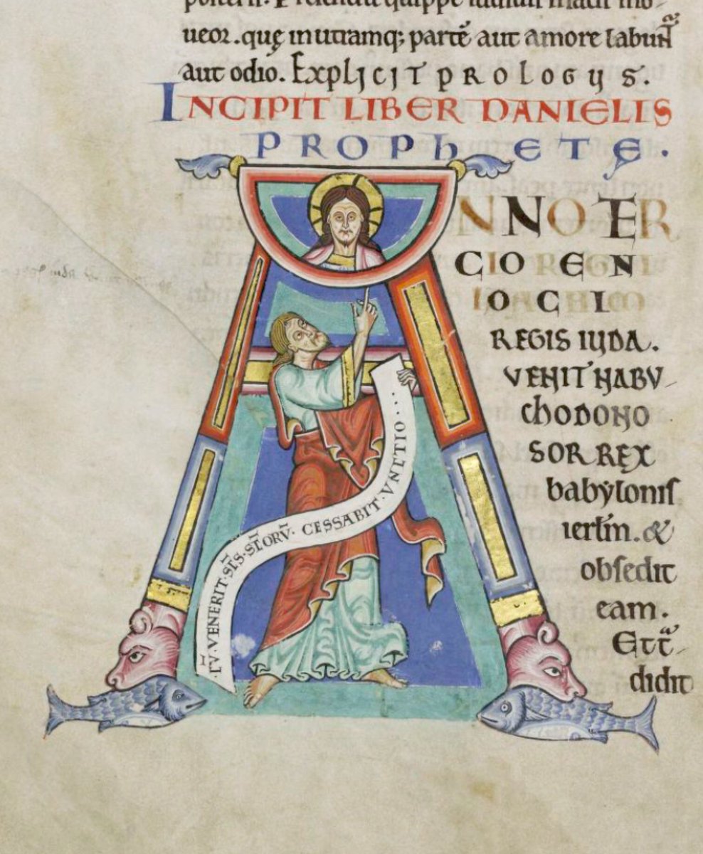 Initial & #39;A& #39;(nno) at the beginning of Daniel pointing up to Christ with two fish at the base of the initial.   #MS003TheDoverBibleCambridge, Corpus Christi College, MS 003; The Dover Bible, Volume I; 12th century; f.245r  @ParkerLibCCCC