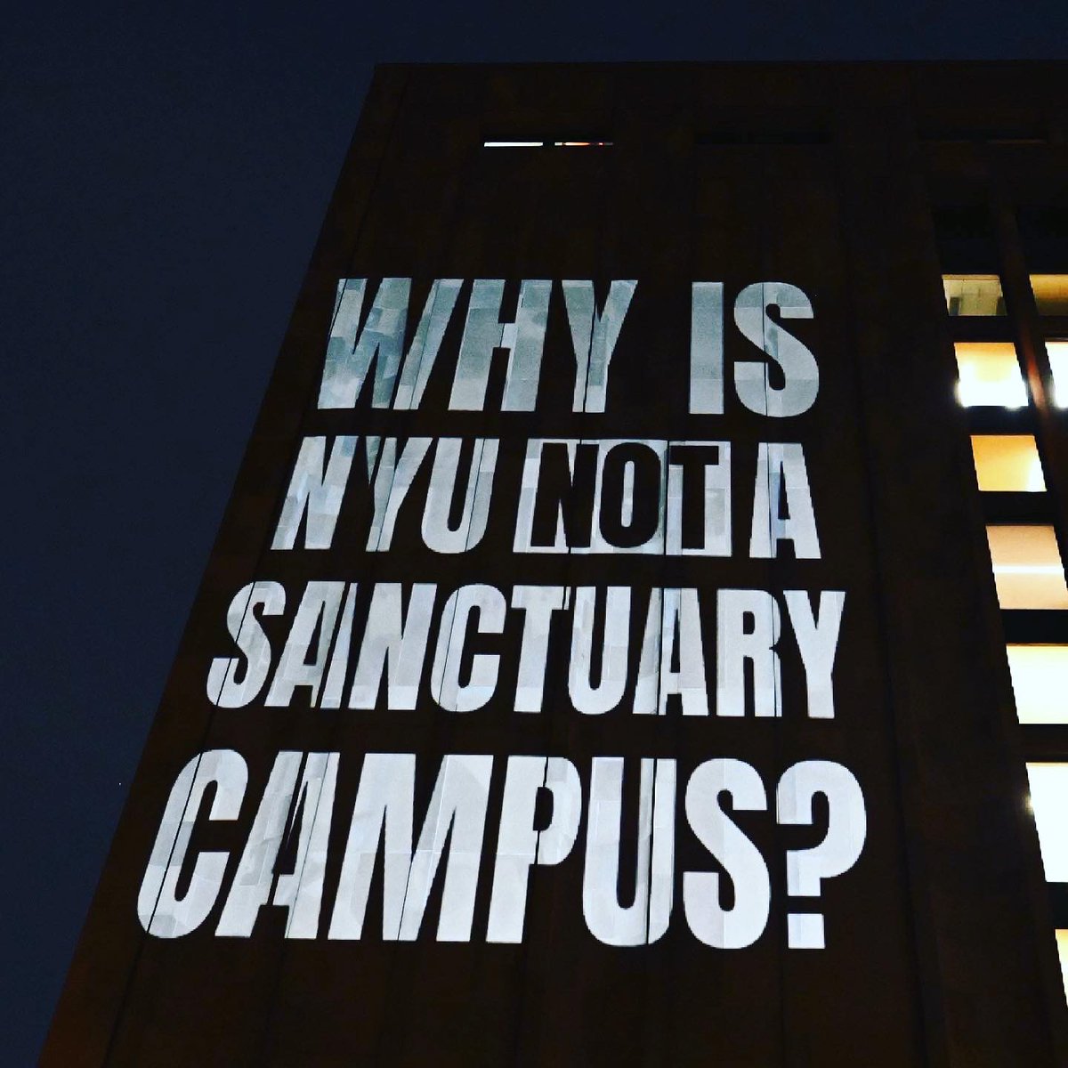 GSOCUAW's tweet photo. Thank you to the amazing @illuminator99 for the public political art at Bobst last night. The entire community and city are watching you👀, NYU. It’s time to give us a fair contract. Do better, NYU. #StrikeOnNYU https://t.co/OlxemGn1yk