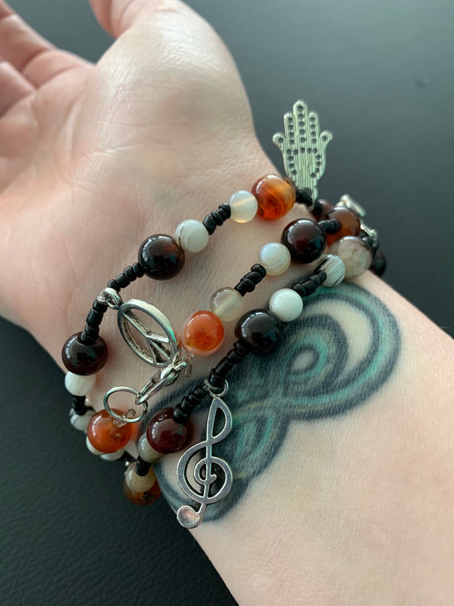 NotMoose6779's tweet photo. Jewelry from my sister. Handmade. That may be a strange assortment of charms, but I’m a strange person so it fits. ❤️ https://t.co/iFmkb4bXW7