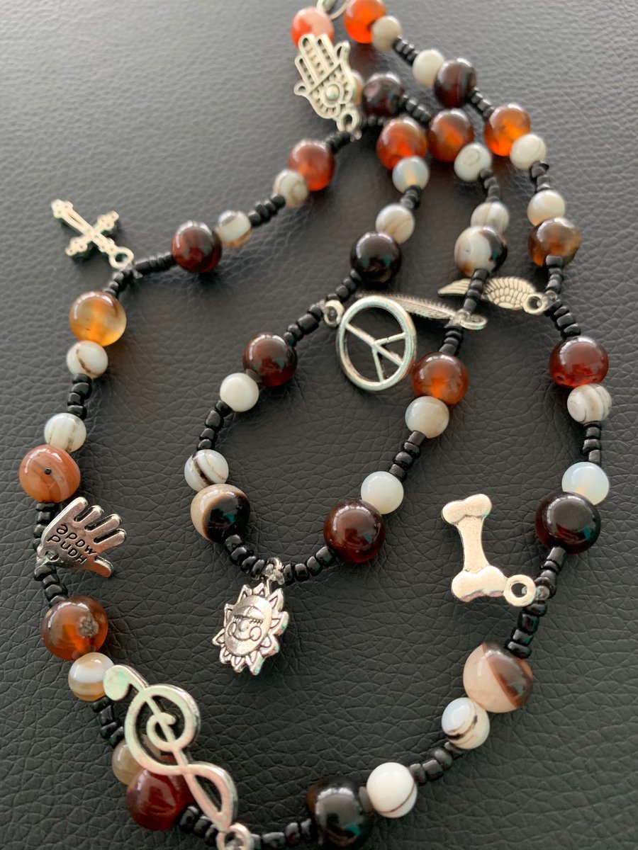 NotMoose6779's tweet photo. Jewelry from my sister. Handmade. Maybe a strange assortment of charms, but I’m a strange person so it fits. #HempandJewelry https://t.co/hmDdMFb57p