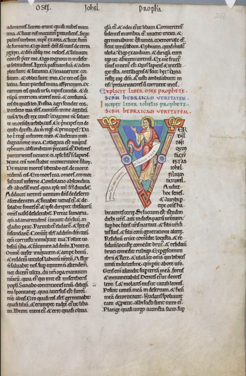 Initial 'V'(erbum) at the beginning of Joel depicting Joel holding a scroll on which is written:'Magnus enim dies domini et terribilis valde'. #MS003TheDoverBibleCambridge, Corpus Christi College, MS 003; The Dover Bible, Volume I; 12th century; f.258r  @ParkerLibCCCC