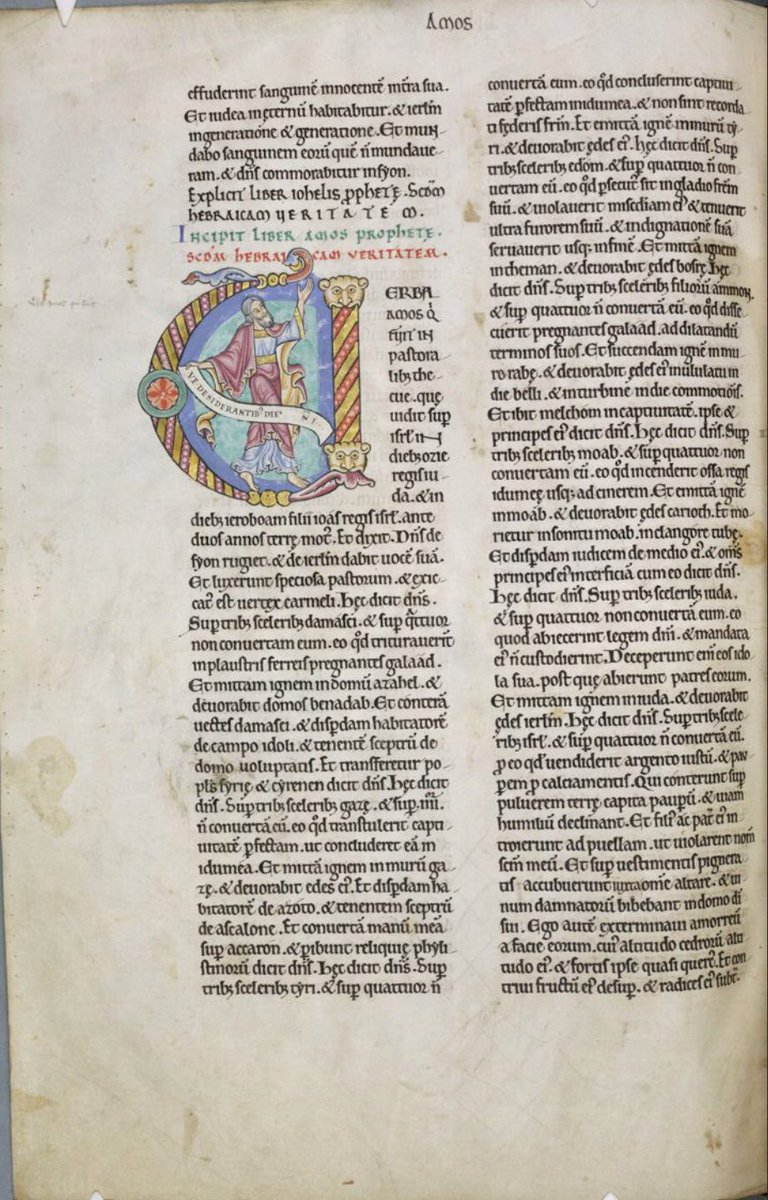 Initial 'V'(erba) atthe beginning of Amos depicting Amos holding a scroll on which is written: 'Ve desiderantibus die(m domi)ni'. #MS003TheDoverBibleCambridge, Corpus Christi College, MS 003; The Dover Bible, Volume I; 12th century; f.259v  @ParkerLibCCCC