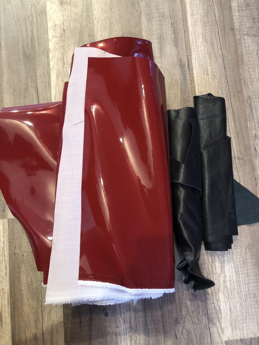 Lot 2Cherry red heavy vinyl in multiple pieces, 2 small pieces of lamb leather used in the Hamilton Hercules Mulligan coat