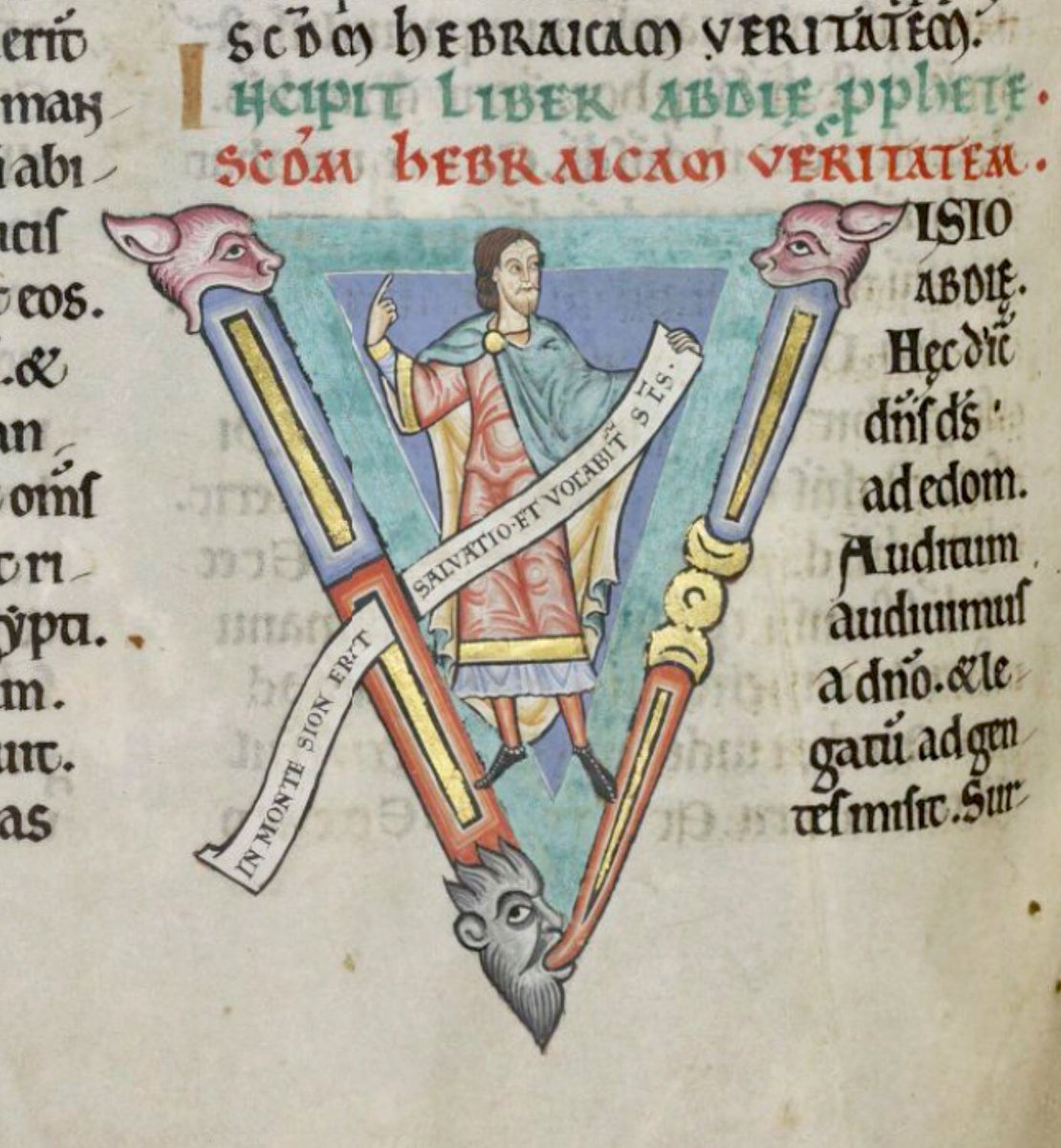 Initial 'V'(isio) at the beginning of Obadiah with Obadiah holding a scroll on which is written: 'In monte Sion erit salvatio et vocabitur sanctus'. #MS003TheDoverBibleCambridge, Corpus Christi College, MS 003; The Dover Bible, Volume I; 12th century; f.261v  @ParkerLibCCCC
