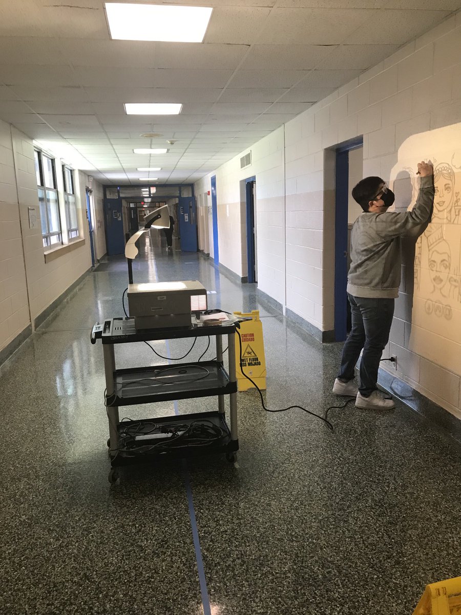 VWLibrarian1's tweet photo. Multicultural Club came up with a wonderful mural idea! Here is Anthony sketching it out. That old tech comes in handy sometimes. 📽Stay tuned...@WCSDEmpowers @GriffinPride2 @ASchout10 #multiculturalclub #avoidstereotyping https://t.co/VPw4zxC6XB