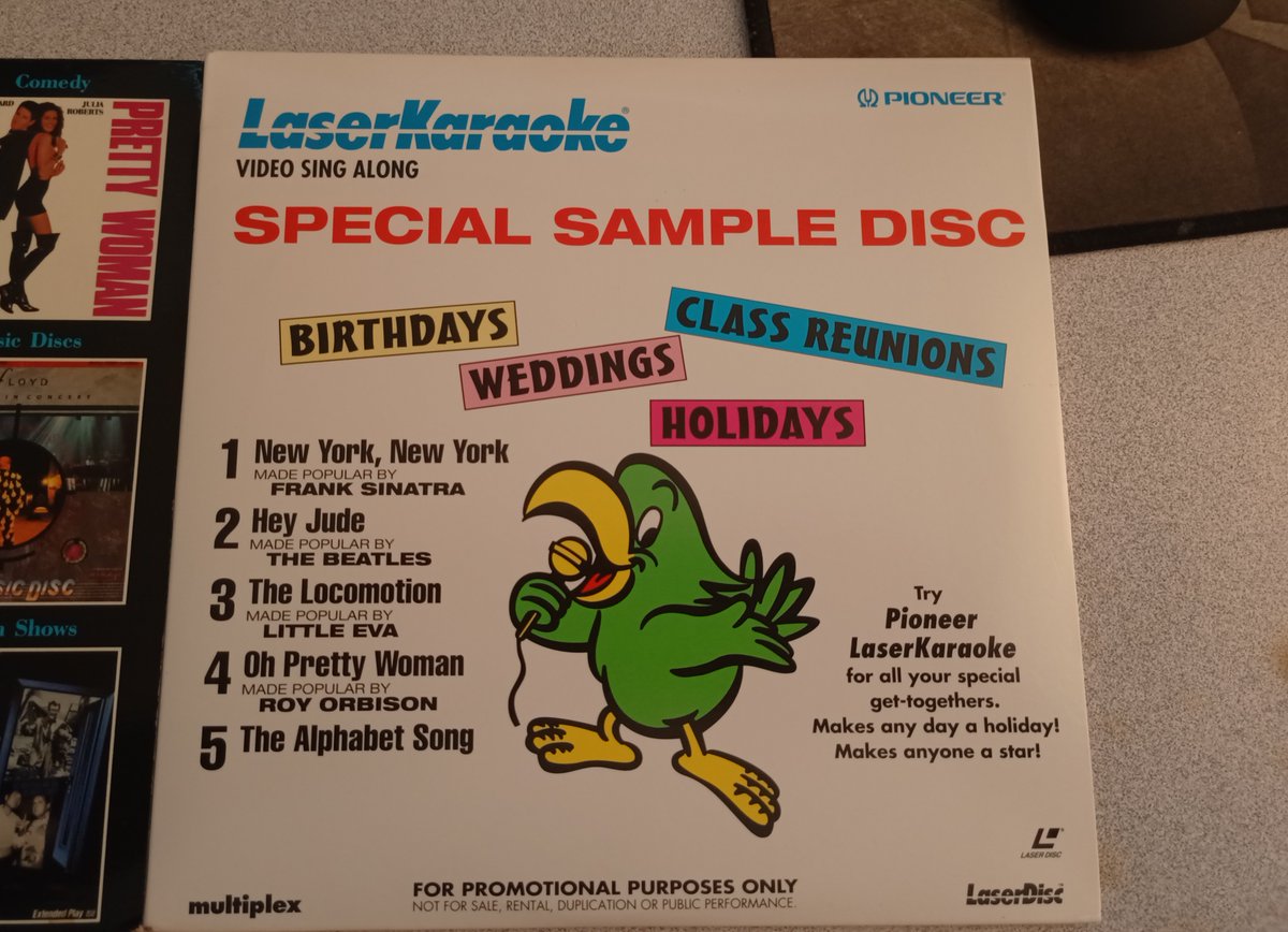 And a LaserKaraoke Special Sample Disc! It's got New York, New York, Hey Jude, The Locomotion, Oh Pretty Woman, and... the alphabet? huh.