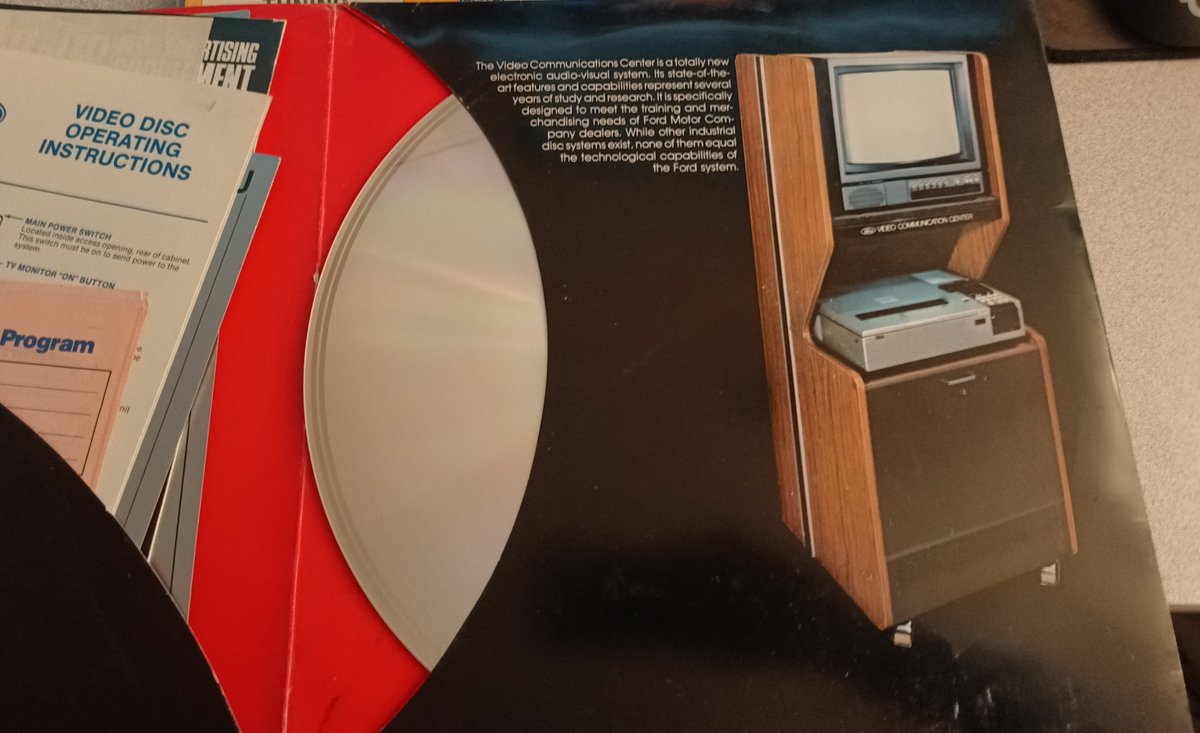 OK this next one is a big deal.It's a fold out Video Communications Network case, but it's actually the first one! it has a picture of the laserdisc setup they used, and even better: IT HAS DOCUMENTATION(Look at that woodgrain!)