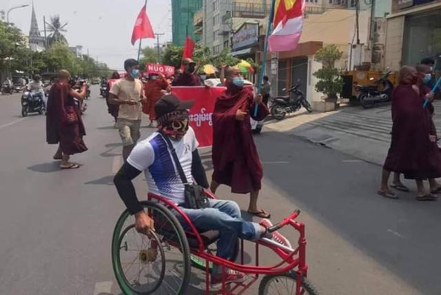 Myanmar_Now_Eng's tweet photo. BREAKING - A man in a wheelchair who took part in Mya Taung rally this afternoon (May 9) have been arrested. “Ko Sai La Min was arrested while waiting for a friend to go back as the crowd was dispersing after the strike,” according to a protester.

#WhatsHappeningInMyanmar https://t.co/oK0e6WNO6G