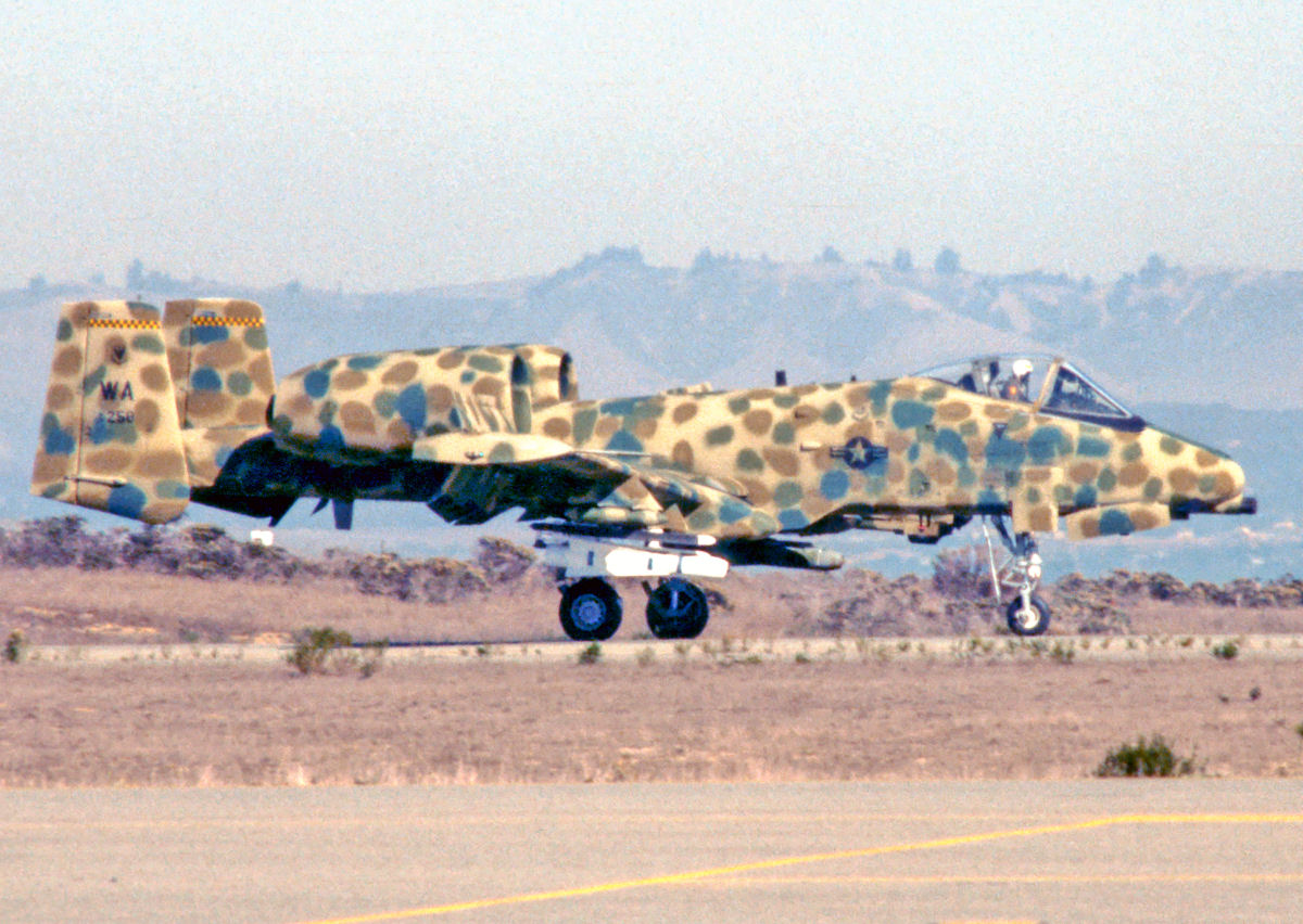 This is another experimental scheme known as the "spotted" or "JAWS" scheme. In '77, the USAF was working on the Joint Attack Weapons System program, where they found the usual Grey color stood out against the terrain (Who woulda thought?) Only 4 planes were painted in the livery