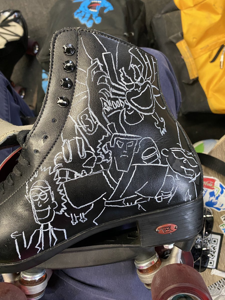 Once those were approved I used a white chalk marker that could be easily wiped off with water if necessary to sketch the characters onto the leather skates. I actually only made a couple small errors that needed to be redone before applying paint thankfully 