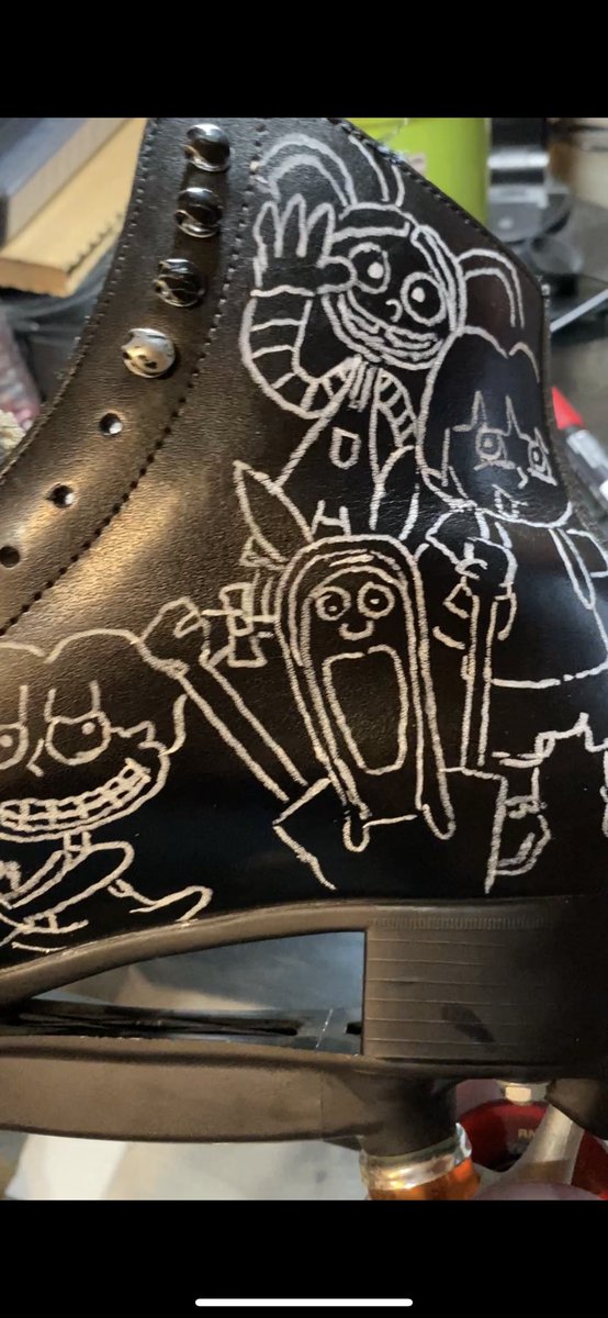 Once those were approved I used a white chalk marker that could be easily wiped off with water if necessary to sketch the characters onto the leather skates. I actually only made a couple small errors that needed to be redone before applying paint thankfully 