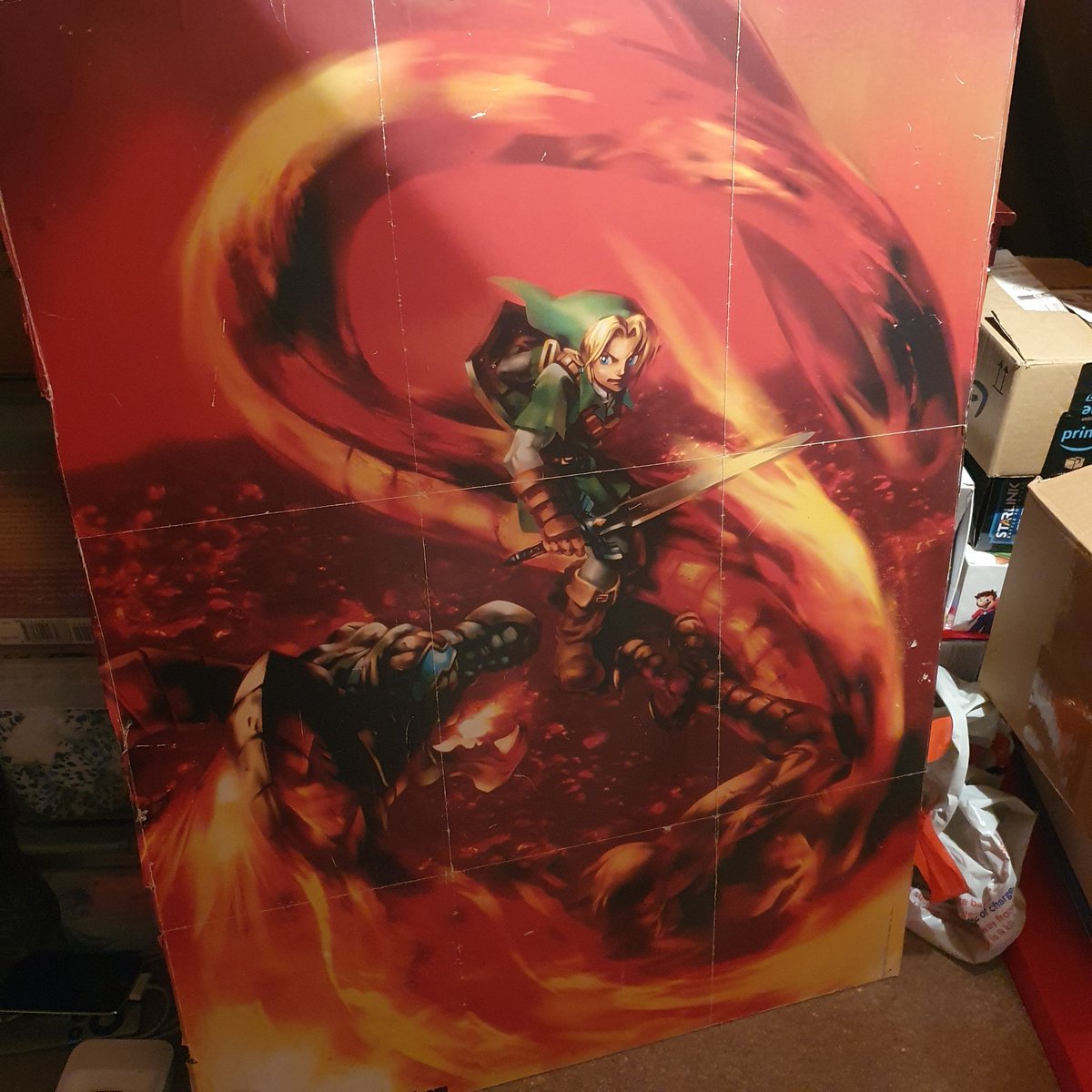 A big old poster of Adult Link fighting Volvagia that I stuck to some chipboard. If I ever have a video room, this is going on the wall.