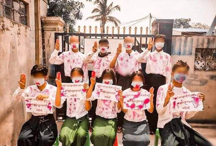 Maymimiko's tweet photo. “We don’t want Slavery Education by Junta” protest in Mandalay by youths wearing red stained school uniforms. GIVE BACK INTERNET #Apr28Coup #InternetShutdown #WhatsHappeningInMyanmar https://t.co/ACT7SClnfb https://t.co/GgHao8J5Bf