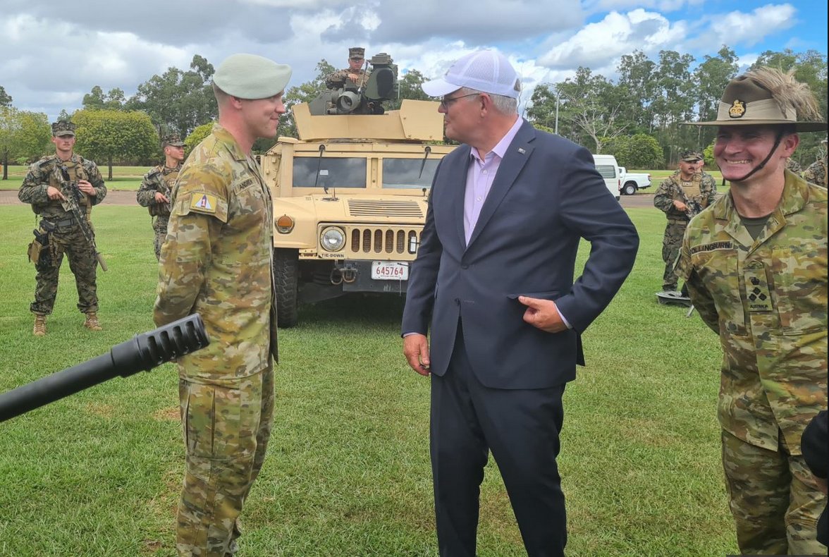 Scott Morrison can't do what other leaders do and organise a military parade with him on a dais as macho tanks and goose stepping soldiers flow past him. Even though his craven, vote chasing team would organise that in a heart beat if they could.So what's the next best thing?