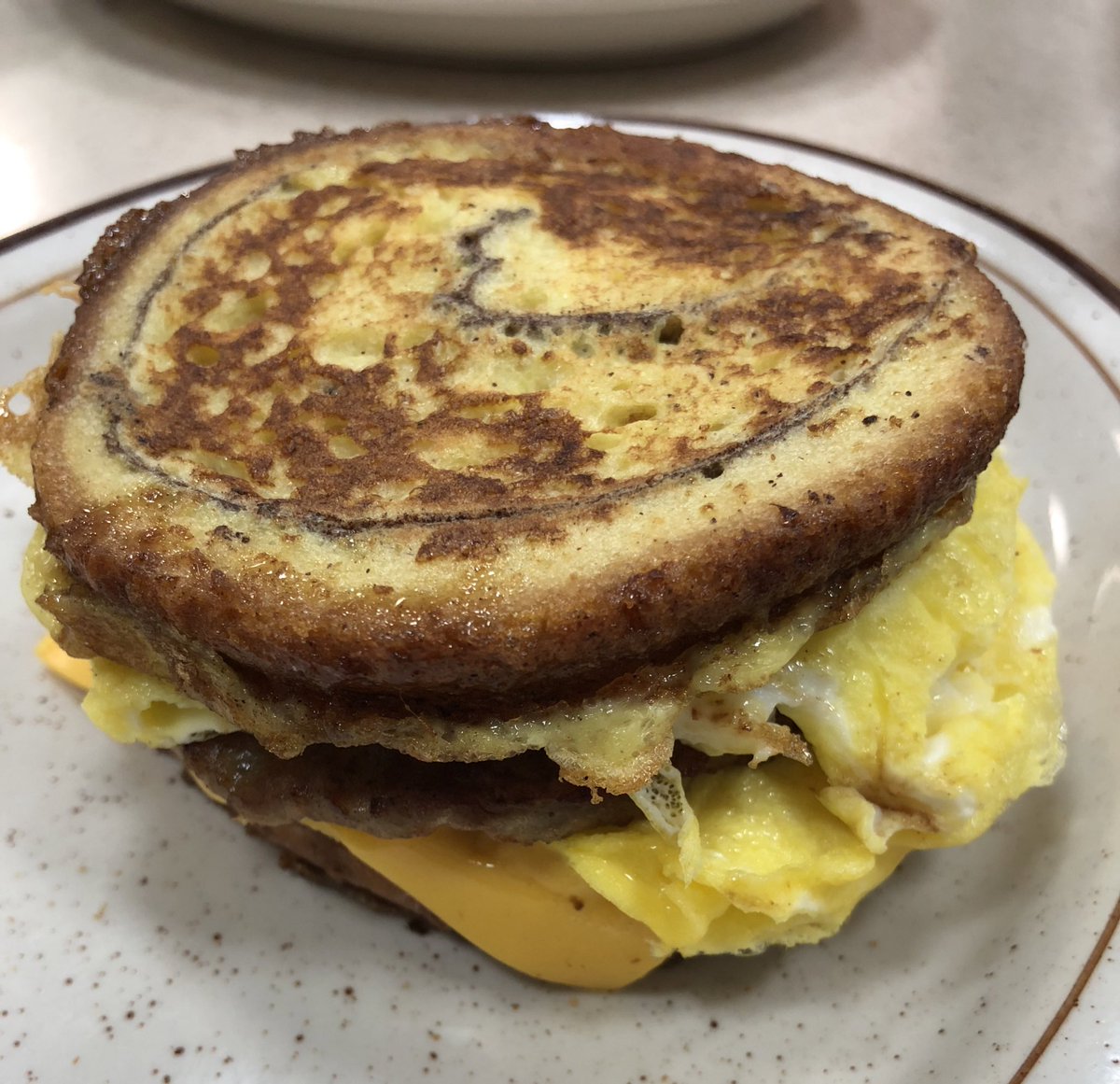 Have you tried our Cinnamon Swirl Egg Sandwich? Egg, sausage and cheese with the bread French toasted, this is the ultimate breakfast sandwich. #frenchtoast #breakfast #eggs #cheese #food #restaurant #sausage #leosconeyisland #savory