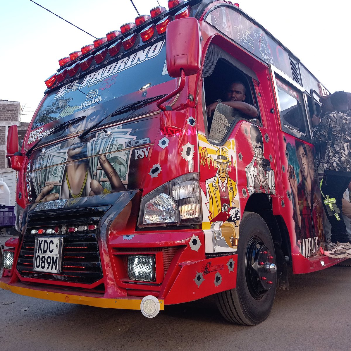 MatwanaCulture's tweet photo. On the Streets Now, Itafute uambie Mbogi!!

🆕️ El Padrino Representin' Umoja Route 35-60 • Designed by #KimCustomz • Fabrication by #Kci •  Sound &amp; Visuals by @banitasounds

#MatwanaMatatuCulture #Matatu #Art #MatatuCulture 
#LongLiveTheMatatuCulture #AgeOfTheCulture #Kenya https://t.co/j3NcJVsW6a